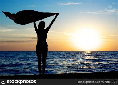 Girl with kerchief on the sunset. Relax scene.