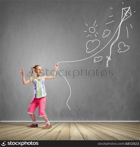 Girl with kite. Image of little girl playing with kite