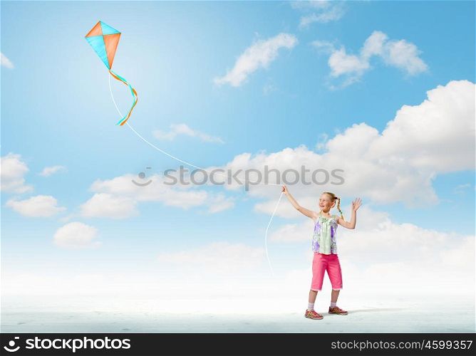 Girl with kite. Image of little girl playing with kite at meadow