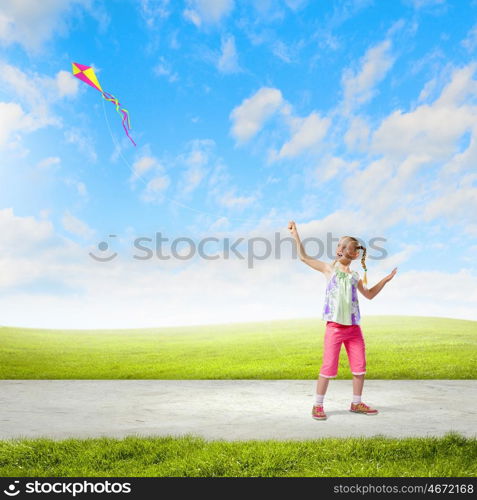 Girl with kite. Image of little girl playing with kite at meadow