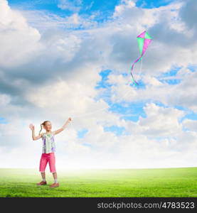 Girl with kite. Image of little girl playing with kite at meadow