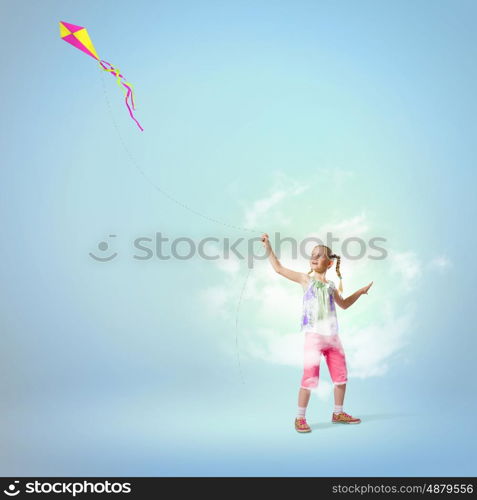 Girl with kite. Image of little girl playing with kite at meadow