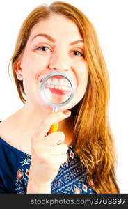 girl with magnifier showing his beautiful white teeth
