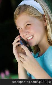 Girl with mobile phone, smiling