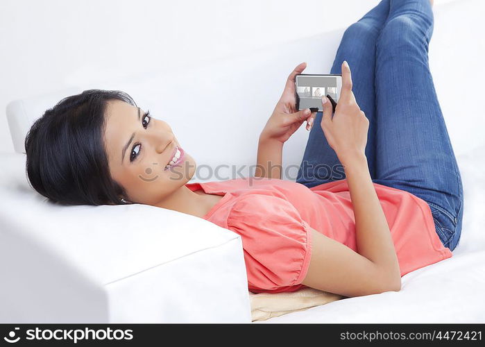 Girl with mobile phone smiling