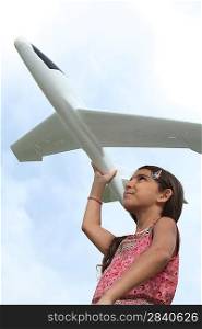 Girl with model airplane