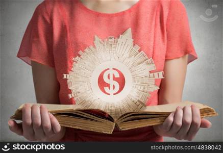 Girl with opened red book. Close view of woman holding opened book and construction concept on pages