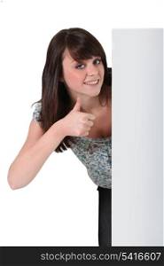 Girl with panel and thumb up