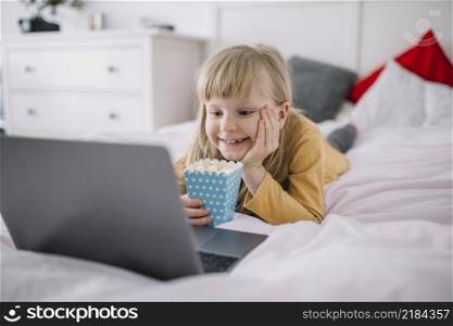 girl with popcorn watching film