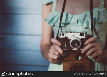 Girl with retro camera. Vintage.