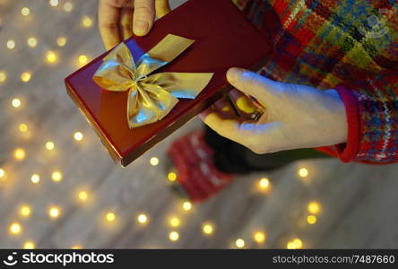 Girl with small gift box at home