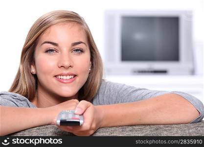 Girl with television remote control