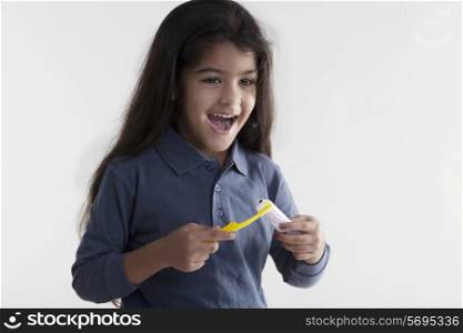 Girl with toothbrush and toothpaste