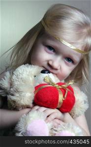 girl with toy bear