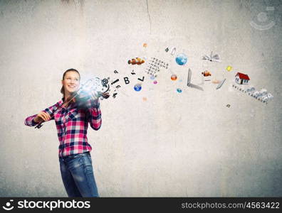 Girl with violin. Young pretty girl in casual playing violin