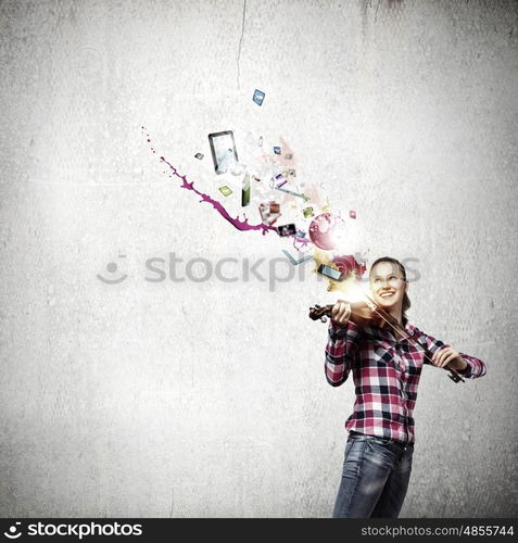 Girl with violin. Young pretty girl in casual playing violin