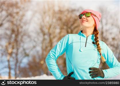 Girl working on her shape. Exercising in winter park. Nature health fitness fashion concept. . Girl working on her shape