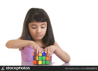 Girl working with Rubiks cube