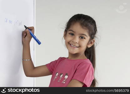 Girl writing on a board