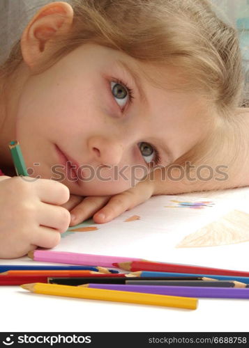 girl writing with pencils