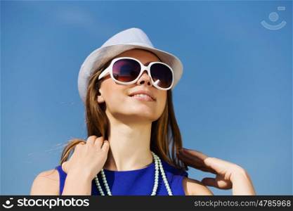 Girl young hat glasses. Attractive young girl in hat and glasses