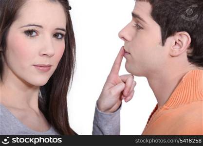 Girlfriend shushing boyfriend