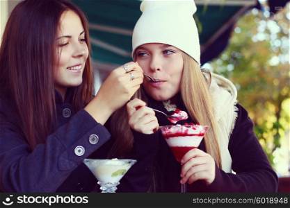 Girlfriends eating dessert