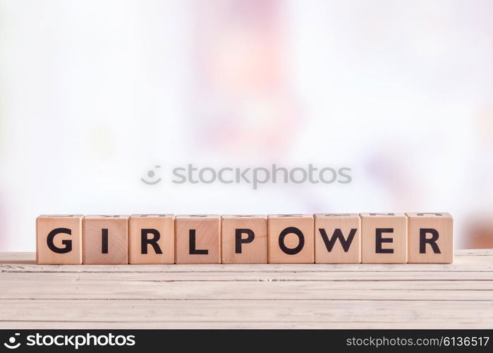 Girlpower sign made of cubes on a table