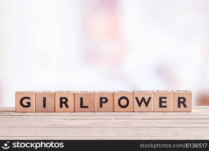 Girlpower sign made of cubes on a table