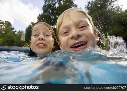 Girls and boy in swimming pool