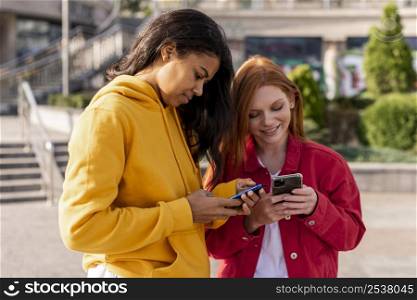 girls checking their phones