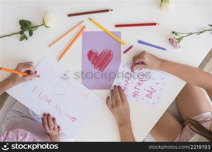 girls drawing greeting cards mothers day