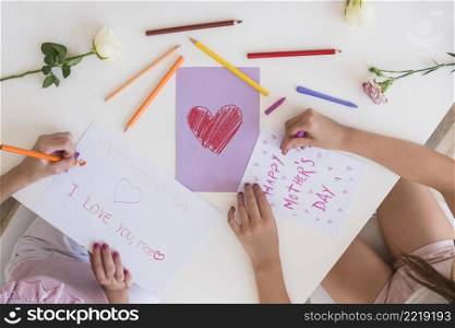 girls drawing greeting cards mothers day