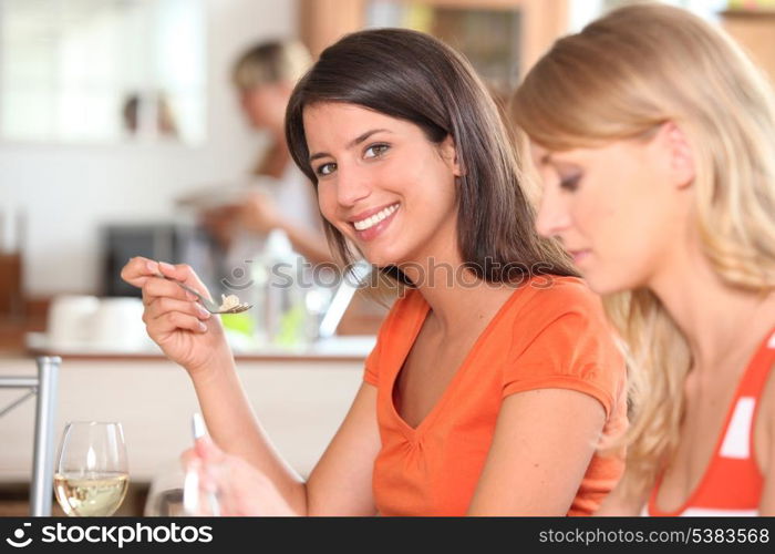 Girls eating in the kitchen