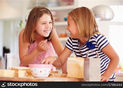 Girls Eating Ingredients Whilst Making Cheese On Toast