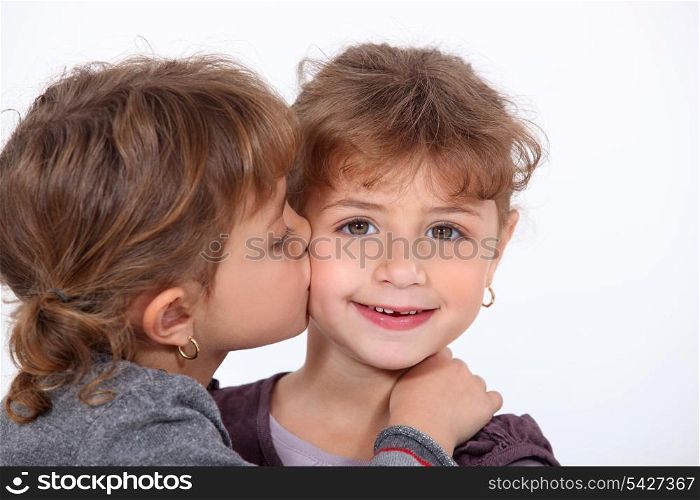 Girls giving a kiss