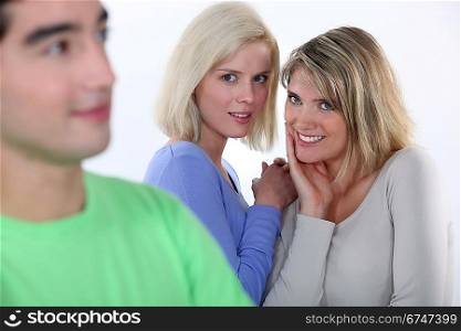Girls gossiping about a boy