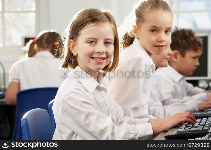 Girls in school class looking to camera