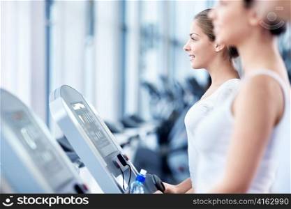 Girls involved in fitness on a treadmill