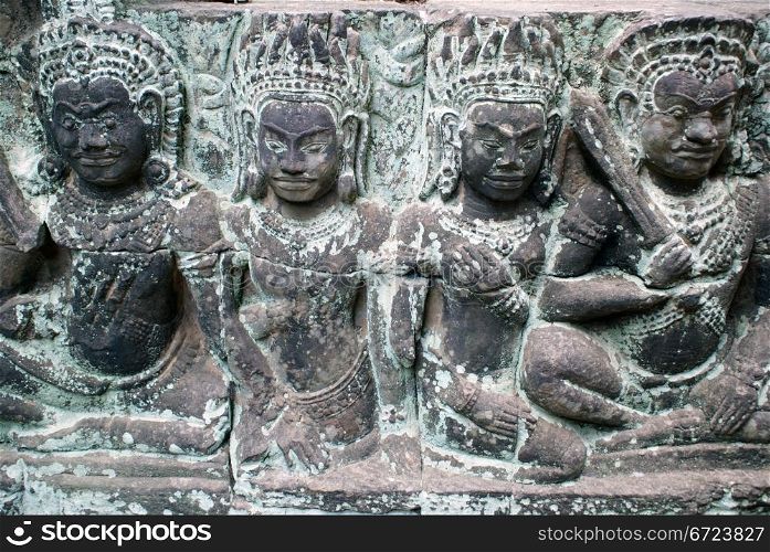 Girls on the wall of temple, Angkor, Cambodia