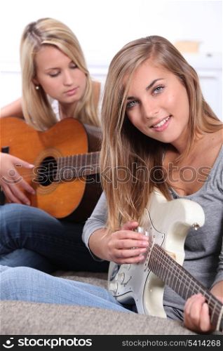 girls playing guitar