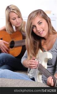 girls playing guitar