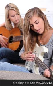 Girls playing guitar