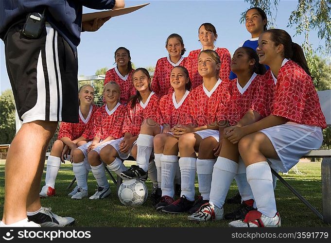 Girls Soccer Team Listening to Coach