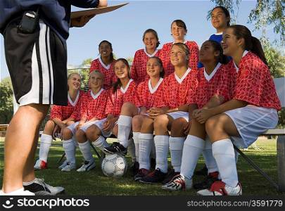 Girls Soccer Team Listening to Coach