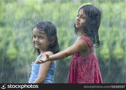 Girls standing in the rain