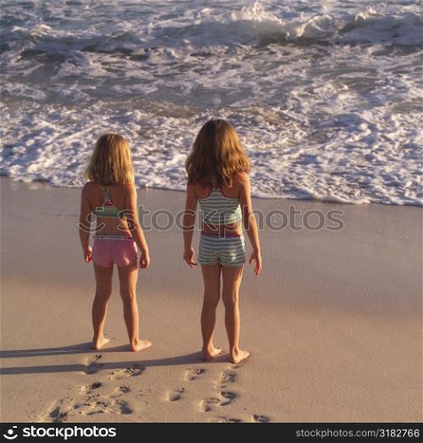 Girls standing on a beach in Costa Rica