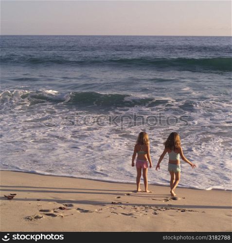 Girls standing on a beach in Costa Rica
