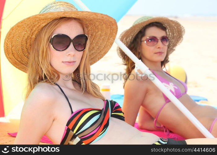 Girls sunbathing on the beach