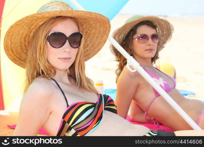 Girls sunbathing on the beach